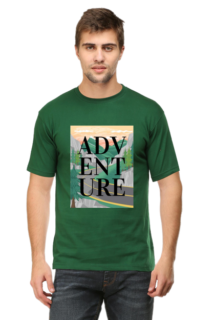 green tshirt with a design of mountains and a road with adventure written on it